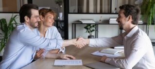real estate agent meeting with clients for consultation